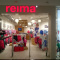 Оформление освещения в магазине детской одежды Reima